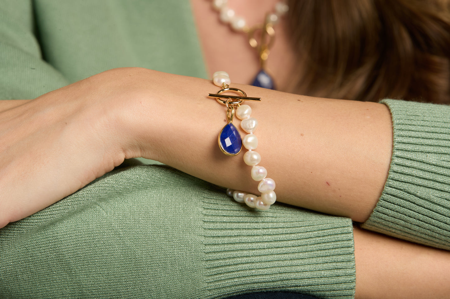 Clara white irregular cultured freshwater pearl bracelet with a lapis lazuli drop pendant