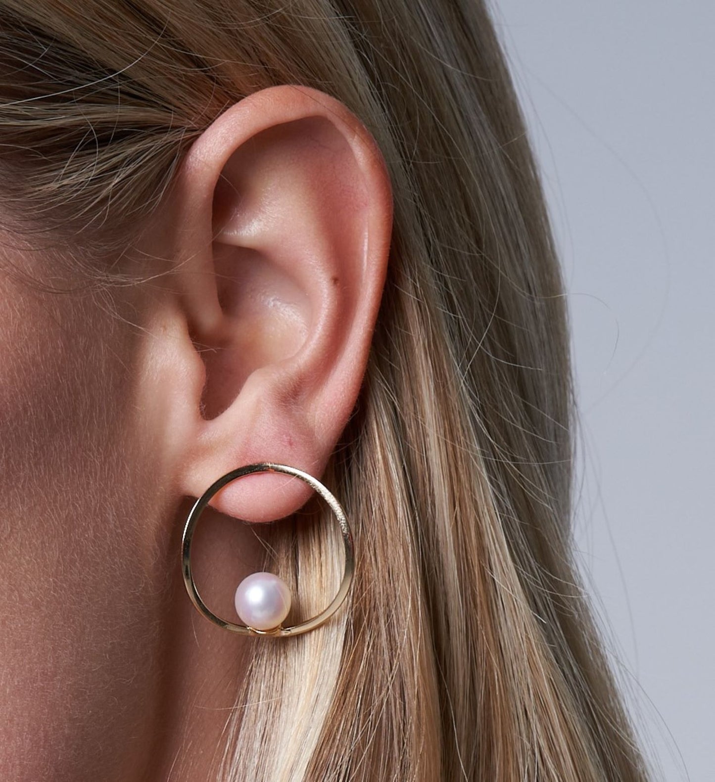 Gratia large gold curved circle stud earrings with cultured akoya pearls