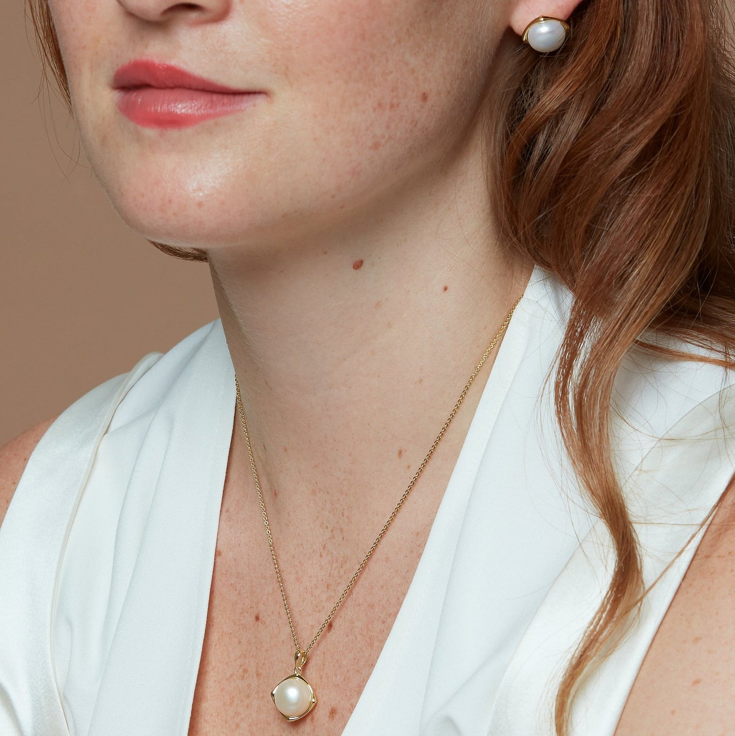Gratia cultured freshwater pearl pendant set in a golden square