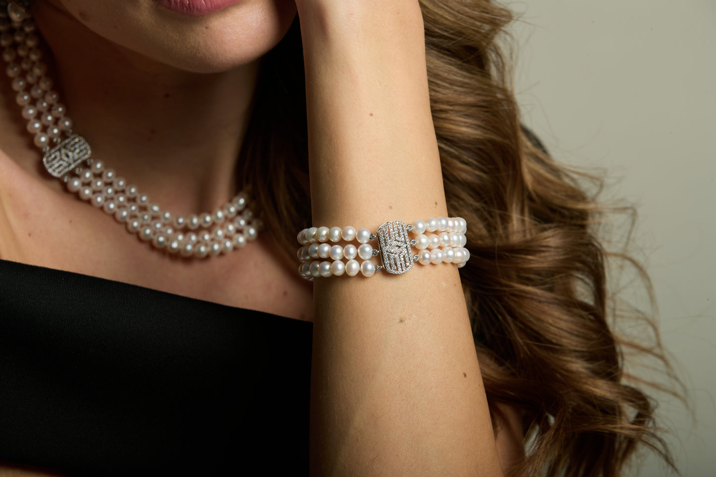 Stella triple strand cultured freshwater pearl necklace with art deco style pave clasp