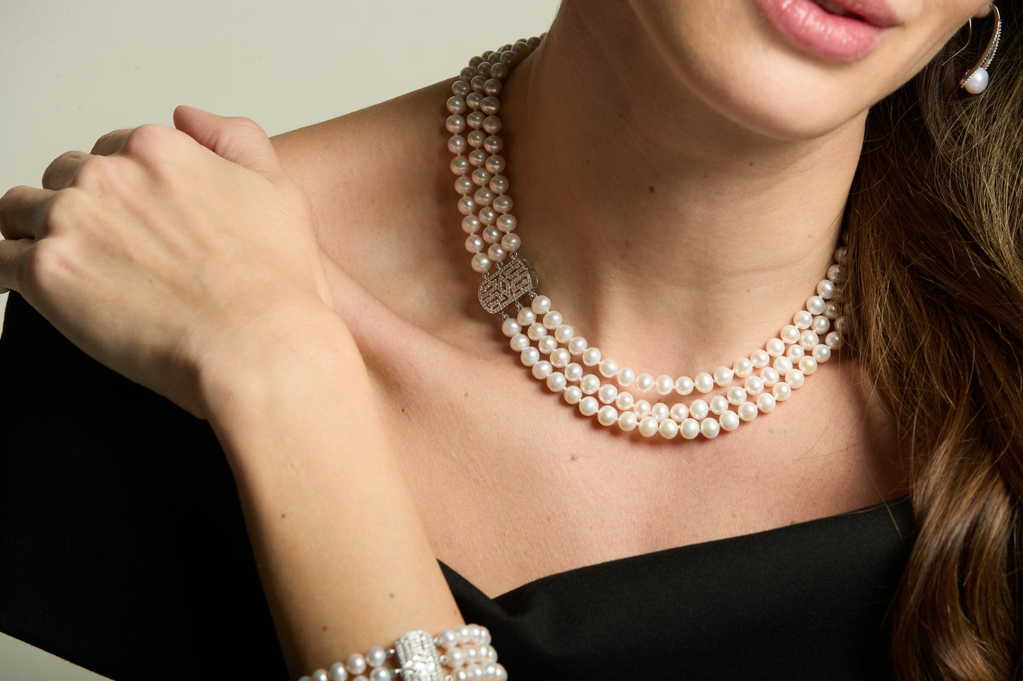 Stella triple strand cultured freshwater pearl necklace with art deco style pave clasp