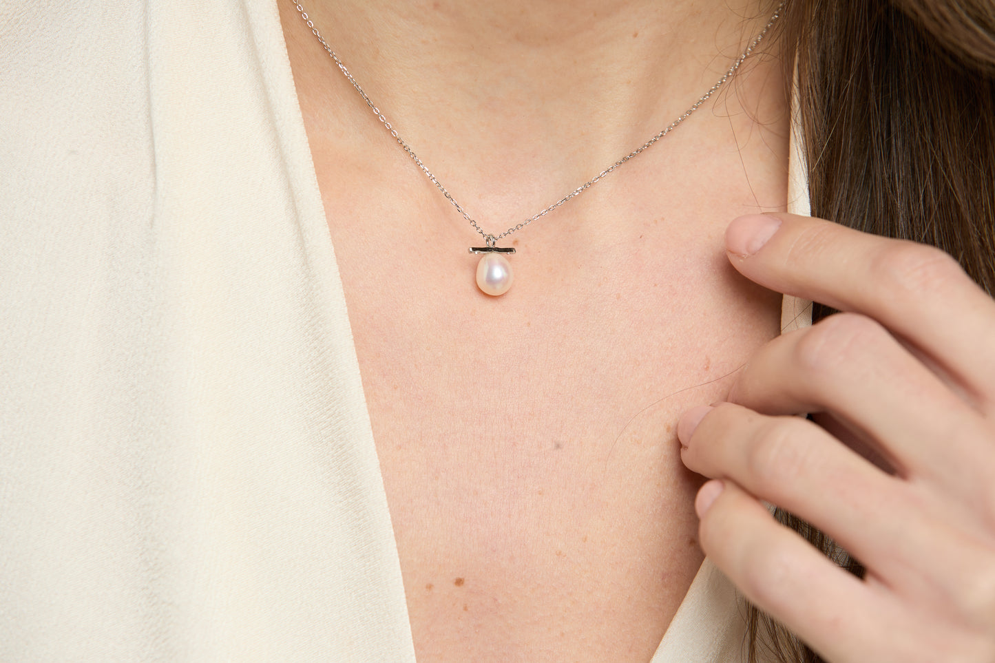 Gratia sterling silver chain with central white cultured freshwater pearl beneath delicate bar