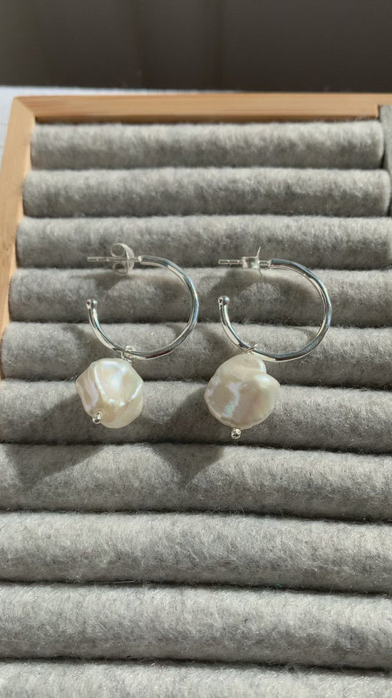 Load and play video in Gallery viewer, Decus Large Silver Hoop Earrings with Baroque Cultured Freshwater Pearl Drops
