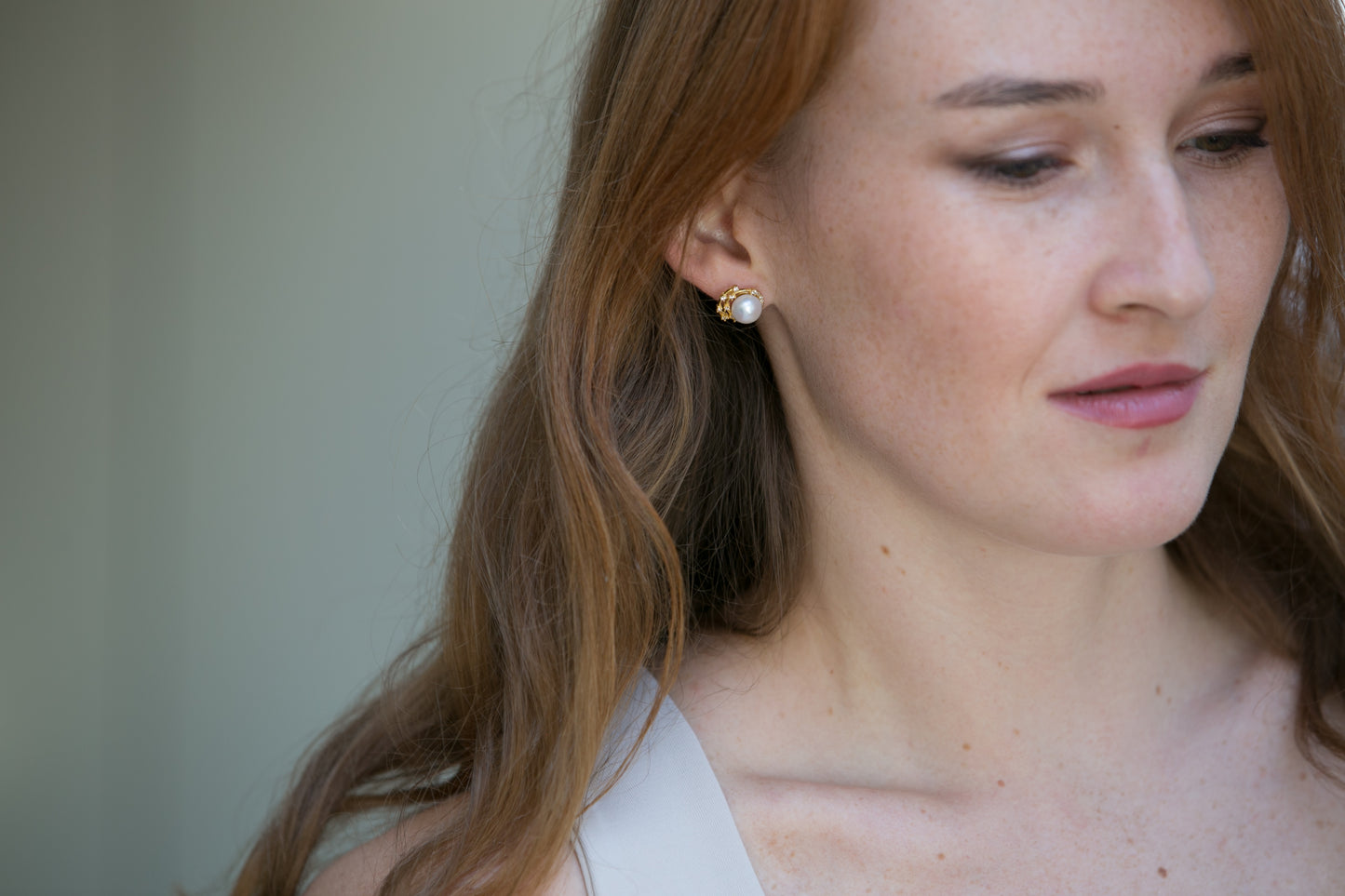 Stella cultured freshwater pearl stud earrings with gold sparkle swirl