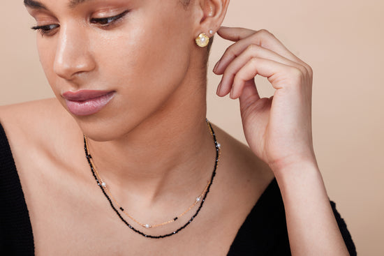 Gold shell earrings with cultured freshwater pearls and black spinel & pearl double fine chain necklace