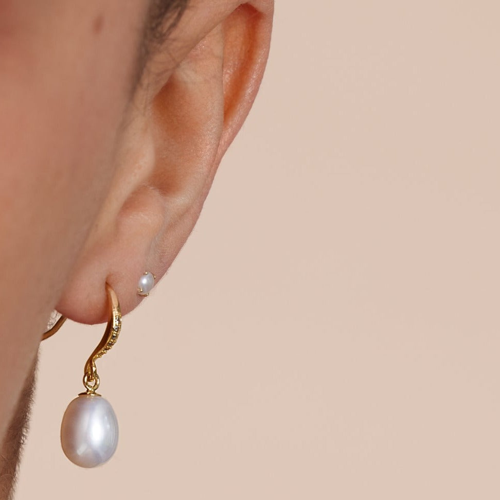 
                  
                    Stella cultured white freshwater teardrop pearl hanging earrings on sparkle gold hooks
                  
                