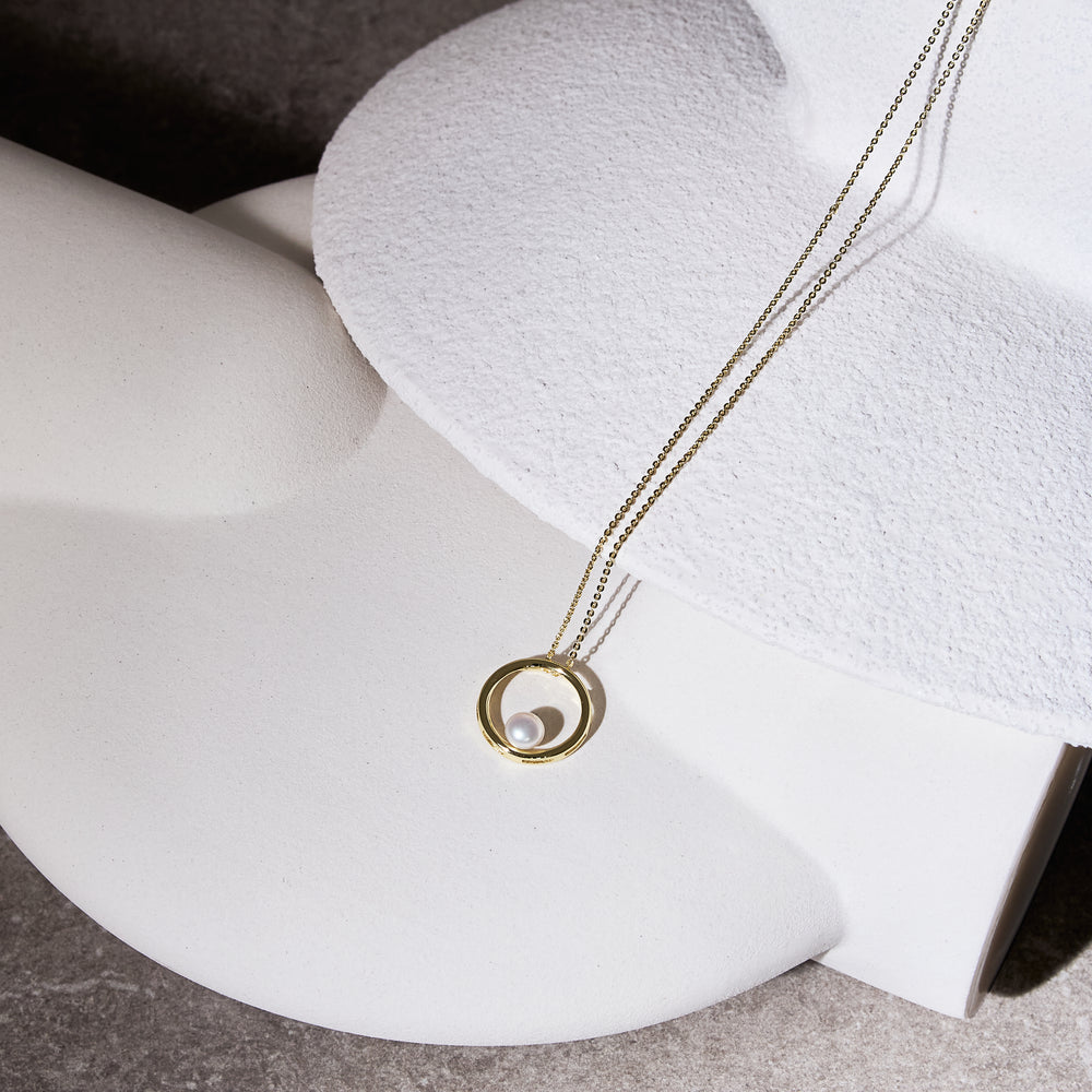 
                  
                    Credo gold circle pendant with cultured freshwater pearl
                  
                