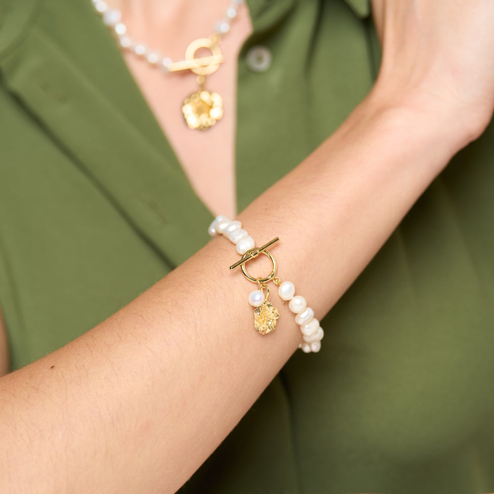 
                  
                    Vita cultured Freshwater Pearl Bracelet with Gold Cherry Blossom Charm
                  
                