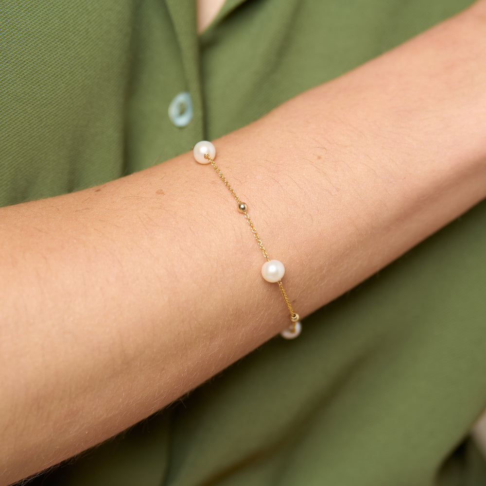 
                  
                    Credo fine chain bracelet with cultured freshwater pearls & gold beads
                  
                