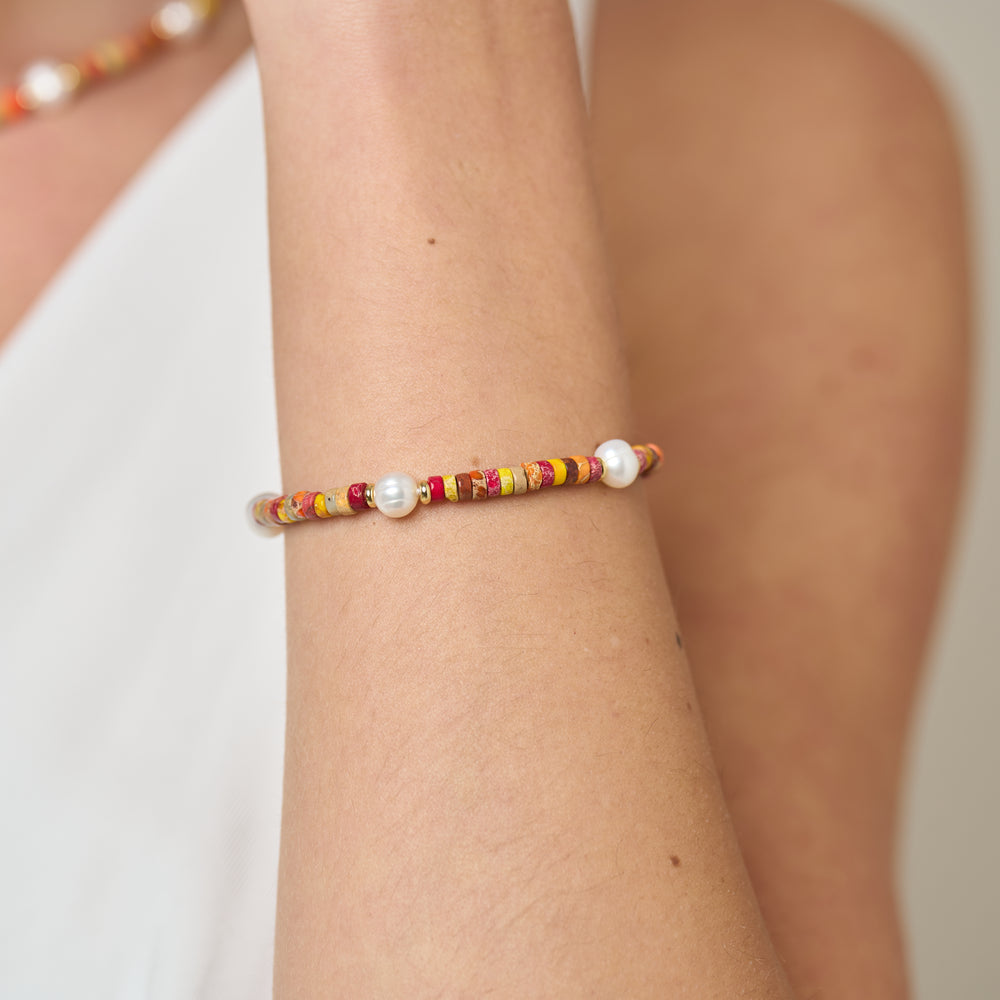 
                  
                    Nova oval cultured freshwater pearl bracelet with orange mix jasper & gold beads
                  
                