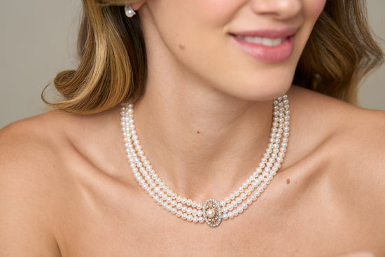 Gratia triple strand cultured freshwater pearl necklace with vintage style oval pave feature