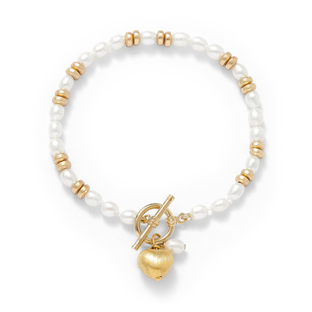 
                  
                    Amare white cultured freshwater pearl bracelet with gold hematite beads & a gold heart charm
                  
                