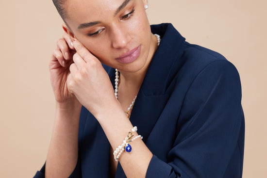 Clara white irregular cultured freshwater pearl bracelet with a lapis lazuli drop pendant