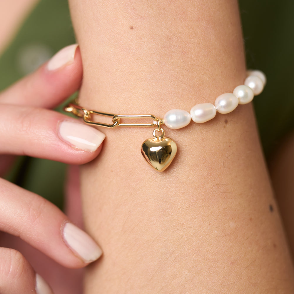 
                  
                    Amare oval cultured freshwater pearl & gold chain bracelet with gold heart
                  
                