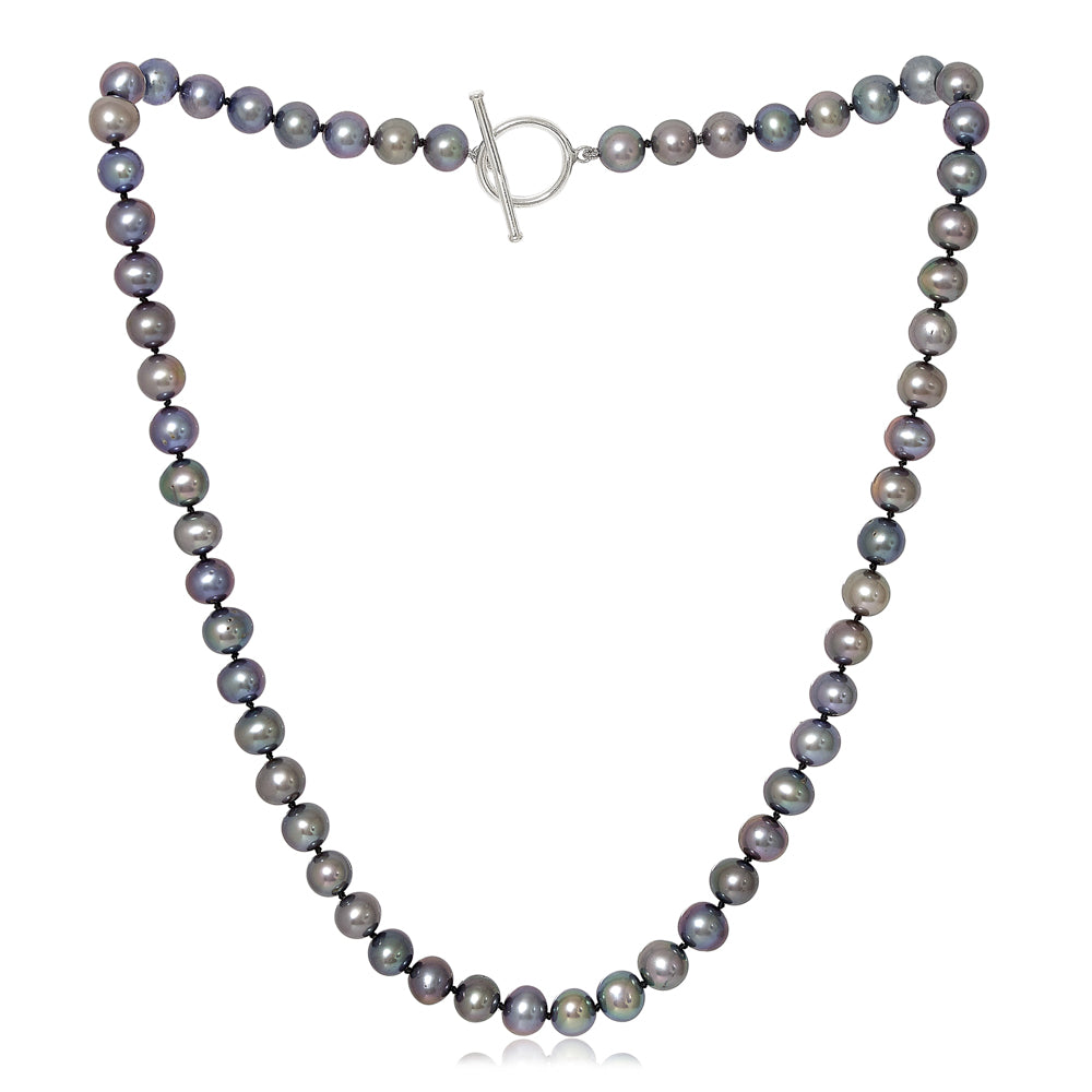 A strand of dark gray and iridescent blue-gray freshwater pearls arranged in a necklace with a silver toggle clasp, shown on a plain white background.