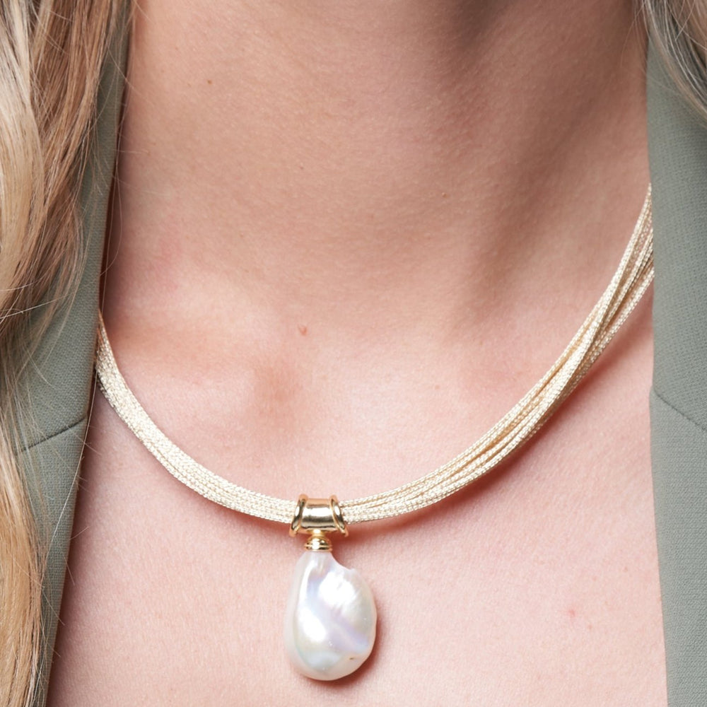 
                  
                    Decus large baroque 'fireball' cultured freshwater pearl drop on multi-strand gold necklace
                  
                