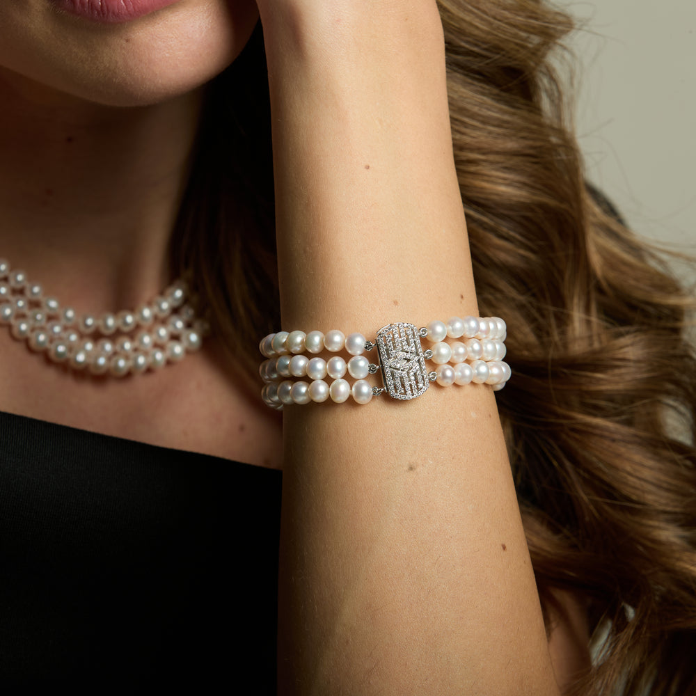 
                  
                    Stella triple strand cultured freshwater pearl bracelet with art deco style pave clasp
                  
                