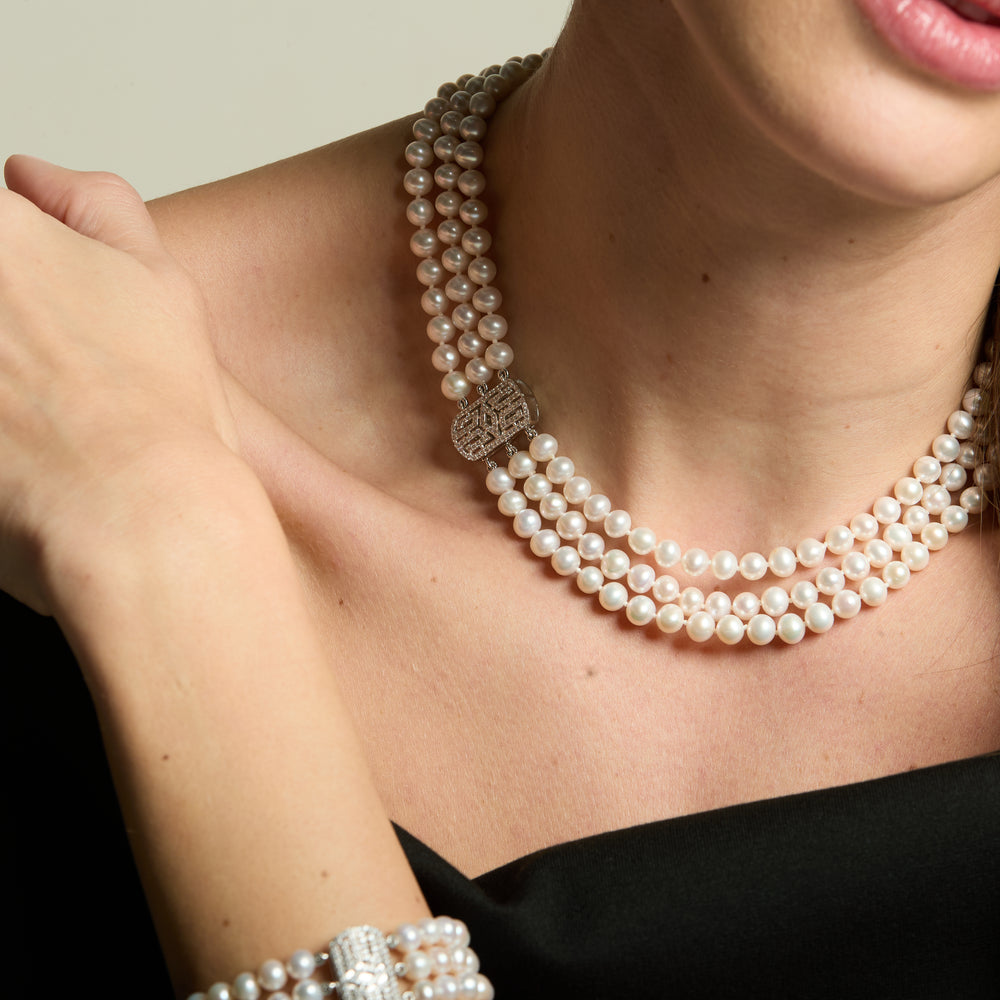 
                  
                    Stella triple strand cultured freshwater pearl necklace with art deco style pave clasp
                  
                