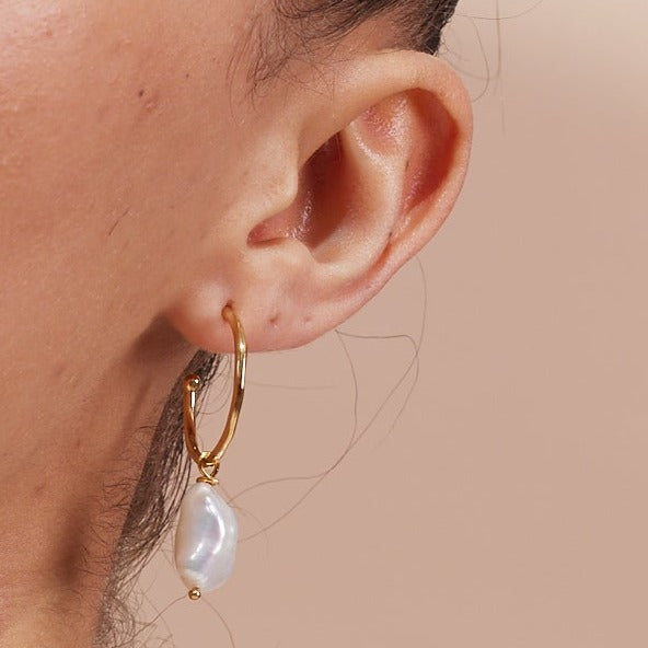 
                  
                    Decus Large Gold Vermeil Hoop Earrings with Baroque Cultured Freshwater Pearl Drops
                  
                