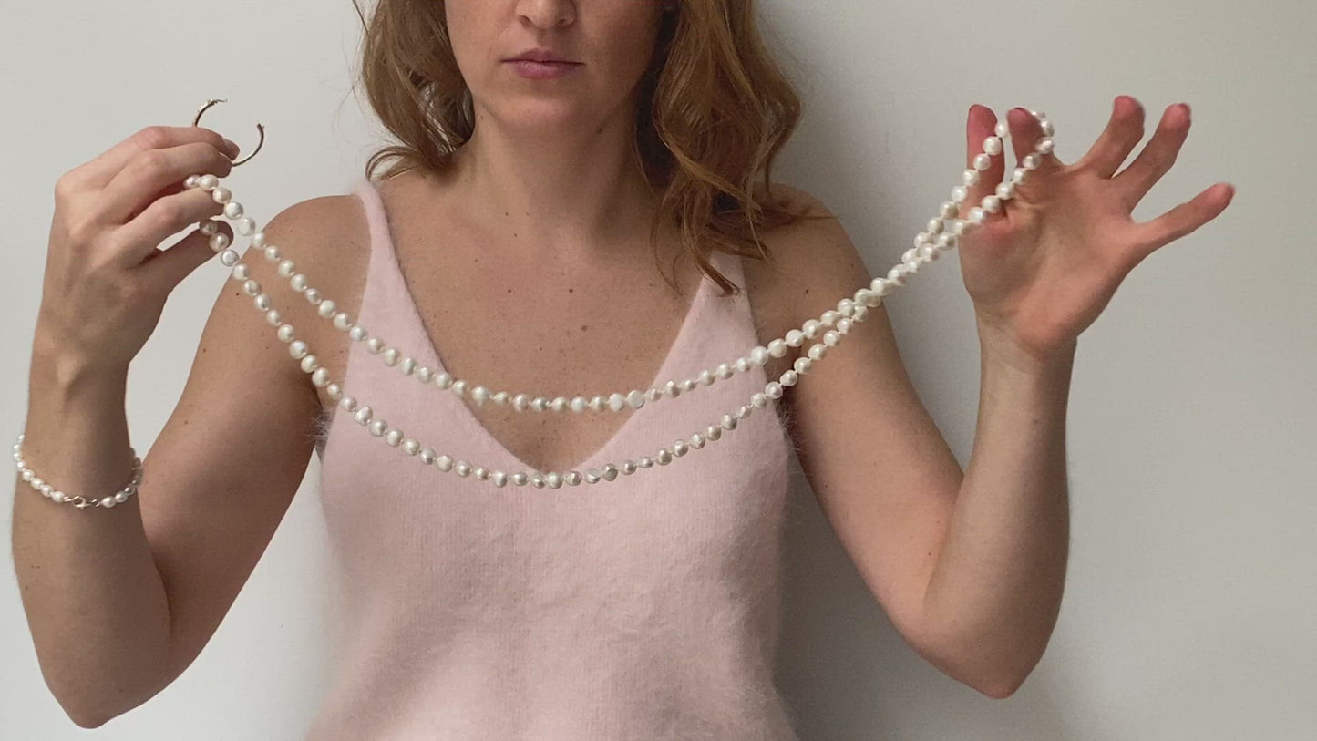 Load and play video in Gallery viewer, Margarita white cultured freshwater pearl loop necklace
