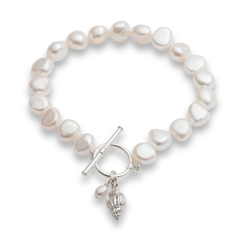 Load image into Gallery viewer, Vita white cultured freshwater pearl bracelet with a sterling silver seashell charm
