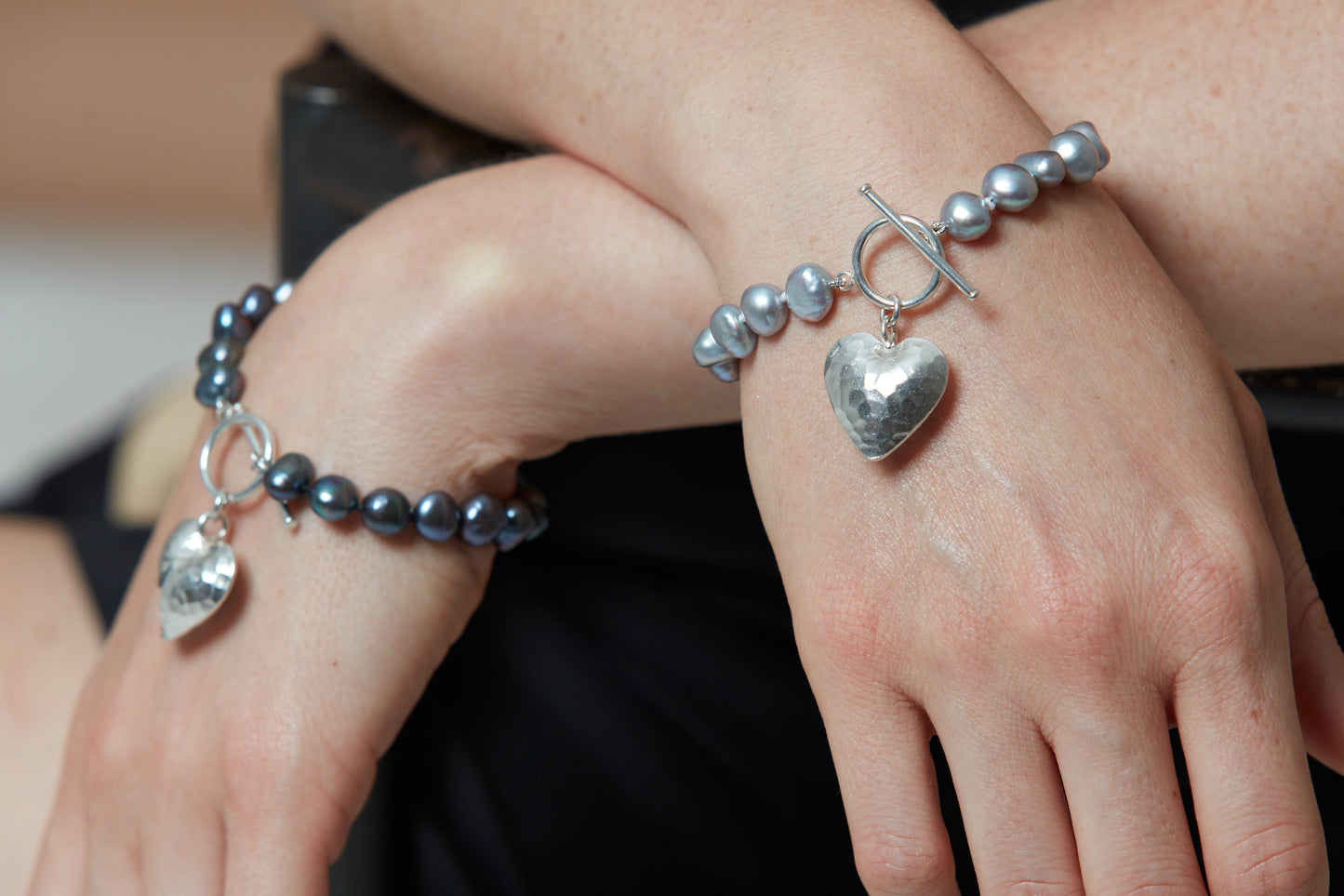 Amare black irregular cultured freshwater pearl bracelet with a silver hammered heart pendant