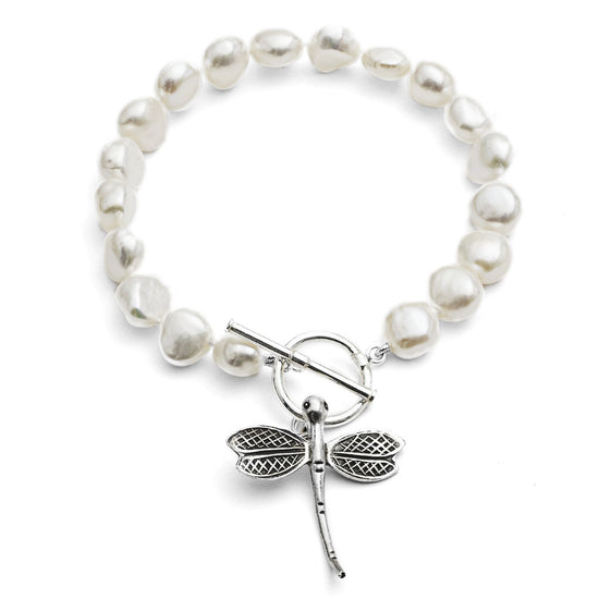 Load image into Gallery viewer, Vita white cultured freshwater pearl bracelet with a sterling silver dragonfly charm
