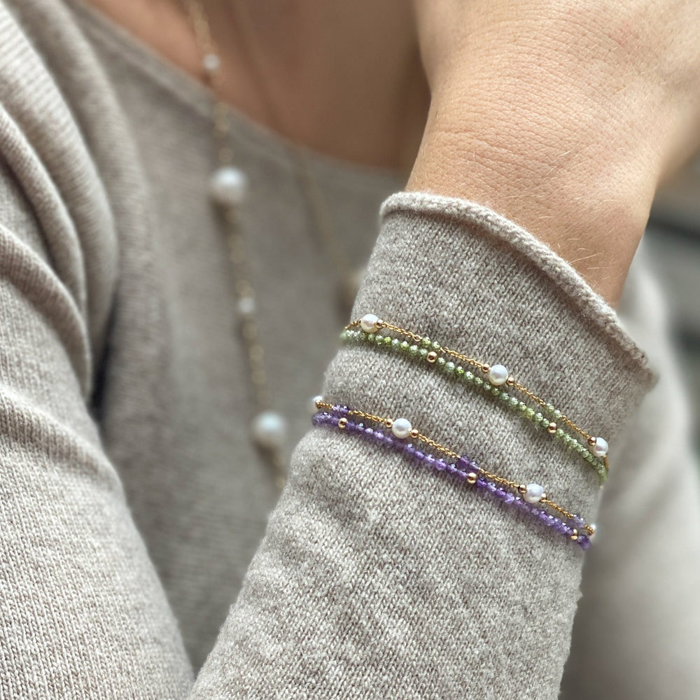 
                  
                    Clara fine double chain bracelet with cultured freshwater pearls & peridot
                  
                