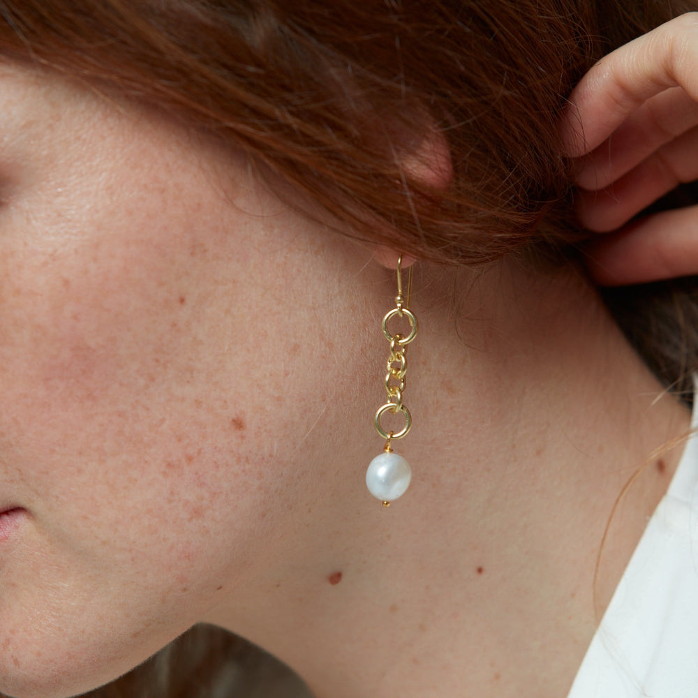 
                  
                    Decus baroque cultured freshwater pearl drop earrings on chunky gold chain
                  
                