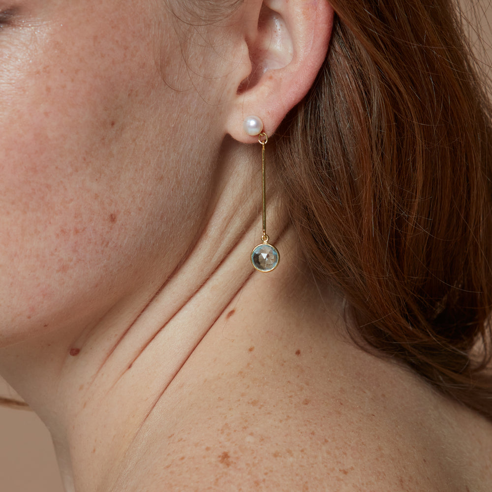 
                  
                    Nova cultured freshwater pearl with gold stem earrings with blue topaz drop
                  
                