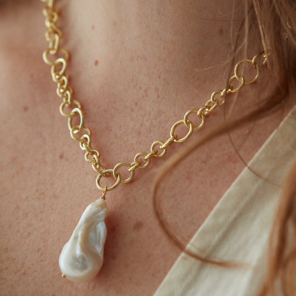 
                  
                    Decus large baroque 'fireball' cultured freshwater pearl drop on chunky gold chain
                  
                