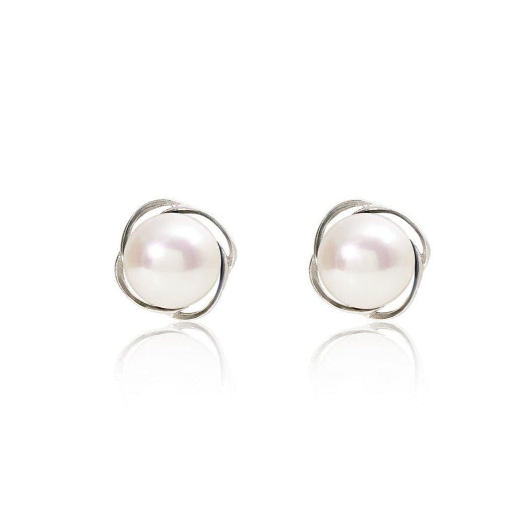 Gratia cultured freshwater pearl stud earrings with silver swirl surround