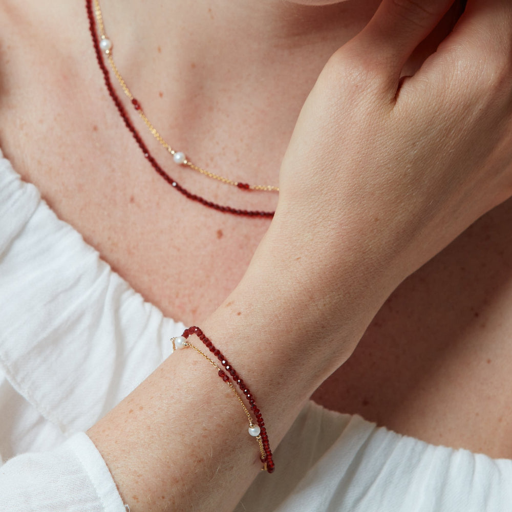 
                  
                    Clara fine double chain bracelet with cultured freshwater pearls & red spinel
                  
                