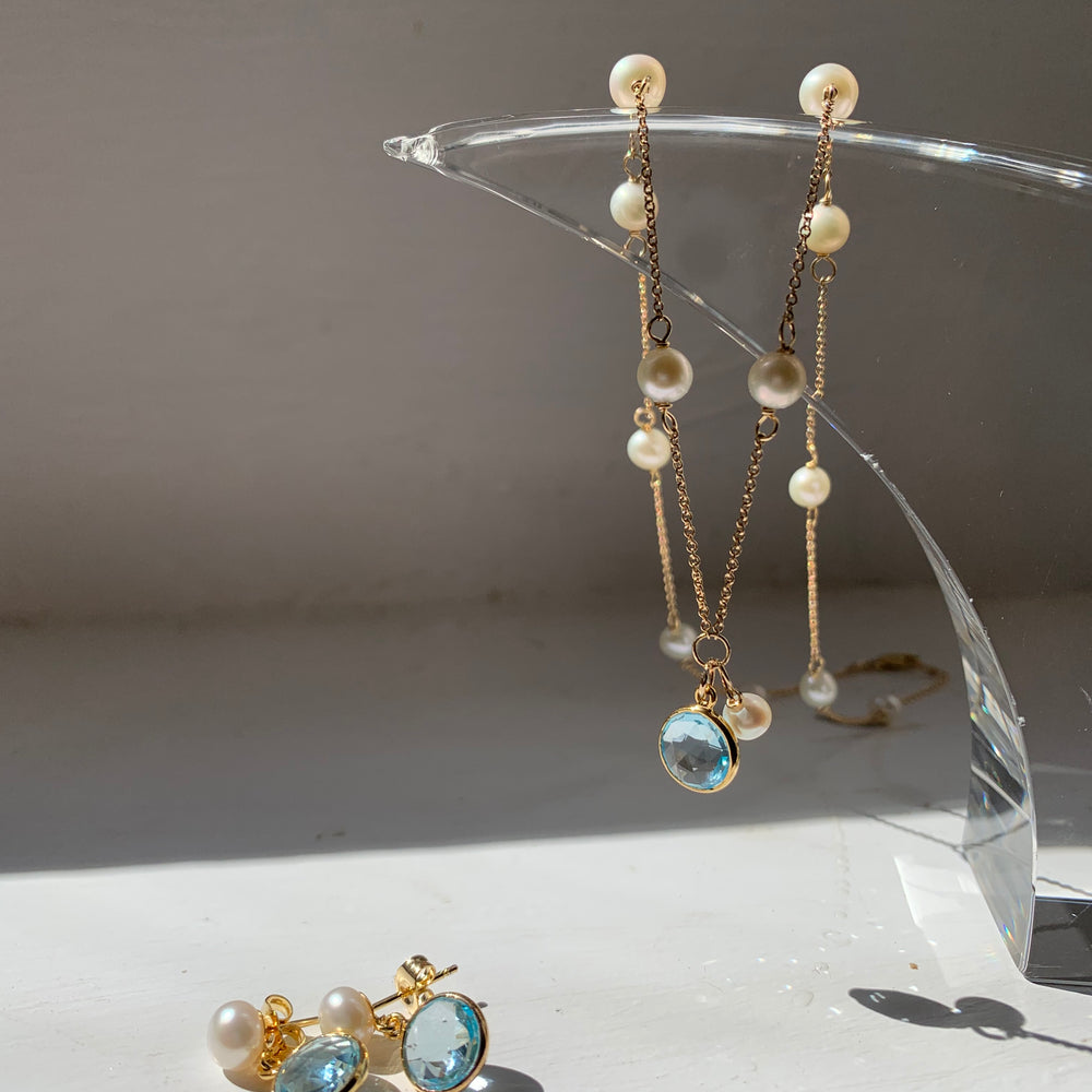 
                  
                    Nova fine chain necklace with cultured freshwater pearls & blue topaz drop
                  
                