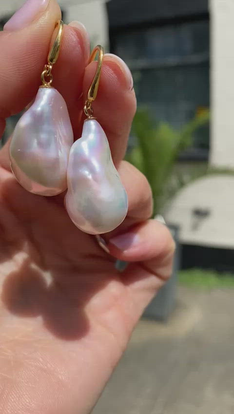 Load and play video in Gallery viewer, Decus large baroque cultured freshwater pearl drop earrings on gold plated silver
