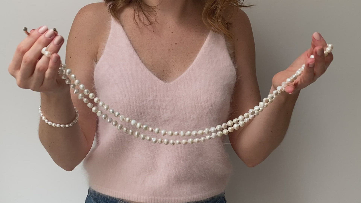 Load and play video in Gallery viewer, Margarita white cultured freshwater pearl loop necklace

